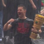 Leverkusen celebrate their unbeaten double in the rain!