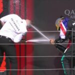 Hamilton and Bono have champagne fight on podium!