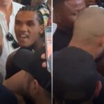 HEATED: Benn shoves Eubank Jr and pair held apart after coming face-to-face