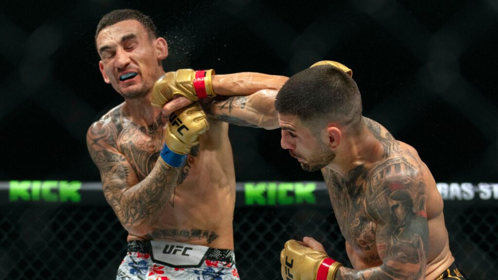 Topuria beats Holloway to retain UFC featherweight title