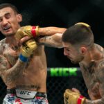 Topuria beats Holloway to retain UFC featherweight title