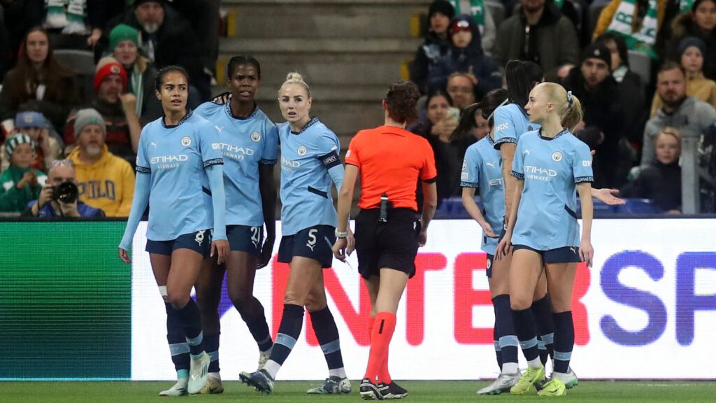 Goalscorer Shaw appears to be struck by object as Man City progress