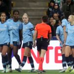 Goalscorer Shaw appears to be struck by object as Man City progress