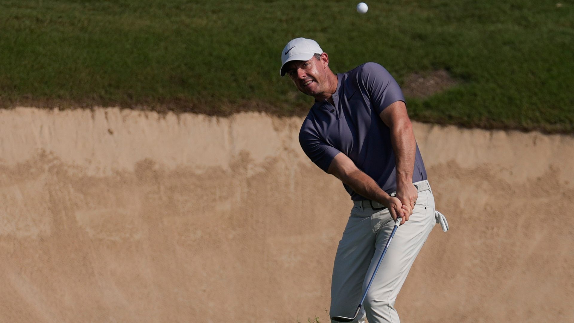 Bunker nightmare for McIlroy as Waring breaks course record