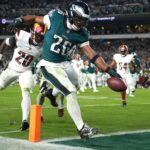 Barkley’s late TD double leads Eagles past Commanders