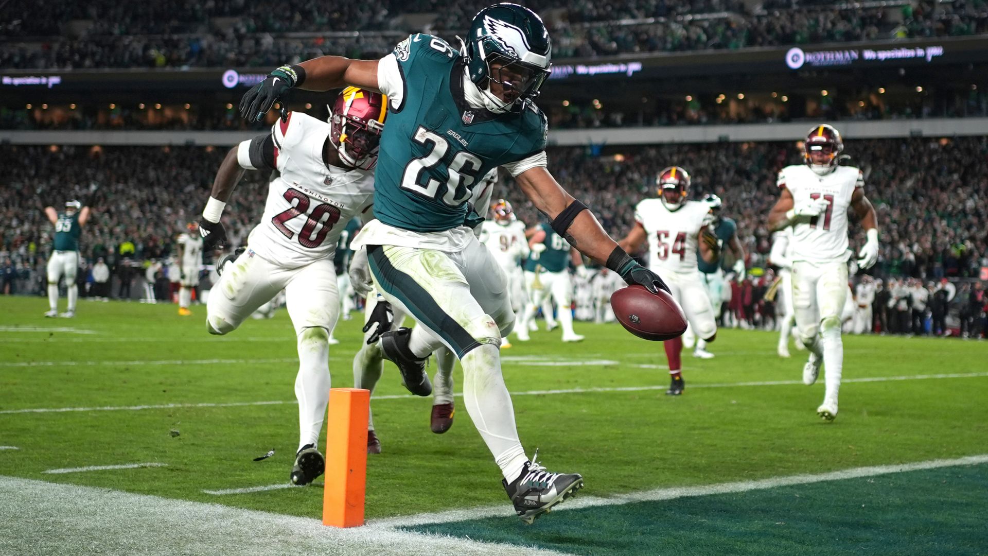 Barkley’s late TD double leads Eagles past Commanders