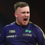 Littler survives scare to threaten nine-darter and win Worlds opener