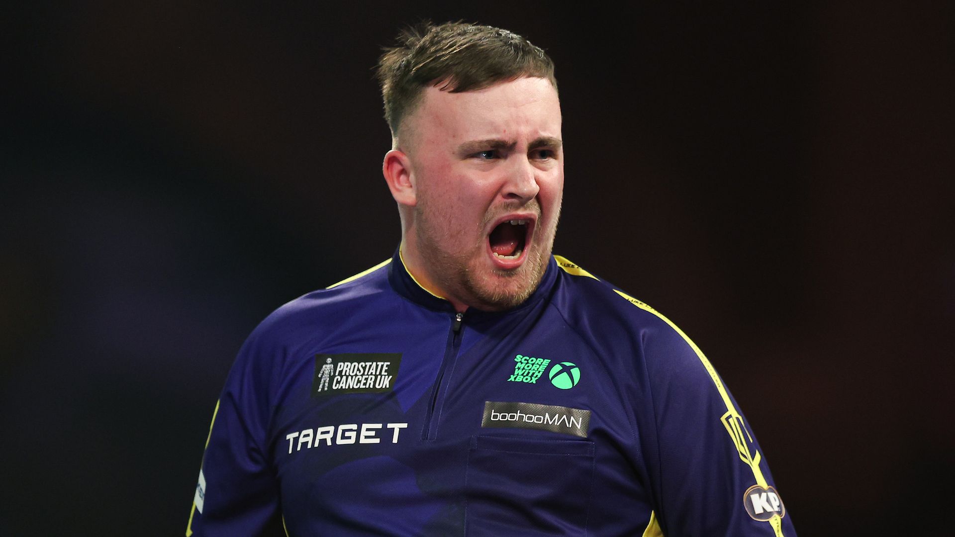 Littler survives scare to threaten nine-darter and win Worlds opener