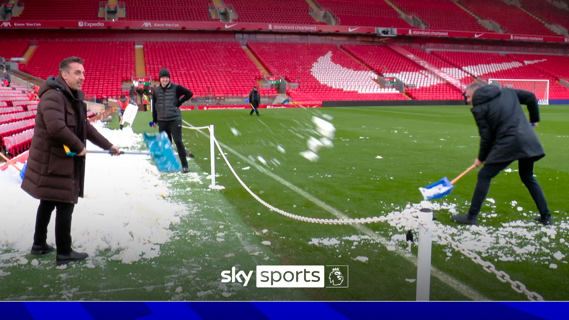 Sabotage!?!? Nev shovels snow onto Anfield pitch and Carra removes it!